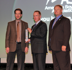 Bryan Perry, of BASF, (left) and ASA President Wade Cowan (right) present Steve Berger (center) with the National Conservation Legacy Award 