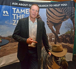Comedian Damian Mason visits with Nufarm's Chip the Zebra