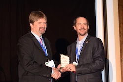 PrecisionAg Executive Editor Paul Schrimpf presents award to Dr. Brian Arnell, OSU