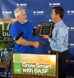 GA farmer Randy Dowdy accepts world record soybean yield award from AJ Woodyard, BASF